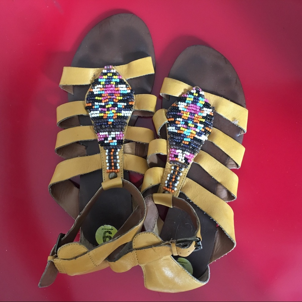 Colorfully beaded moccasin / gladiator sandal.